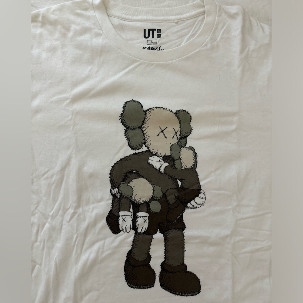 Uniqlo x Kaws Tee in White size Large. Wore once. Like new! Excellent condition.